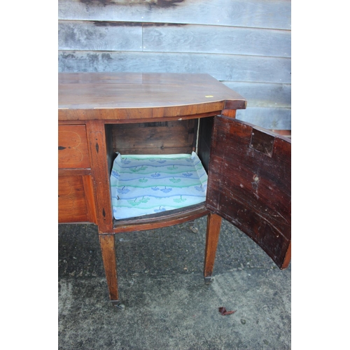 427 - A 19th century mahogany break bowfront sideboard, fitted two central drawers flanked cupboards, on s... 