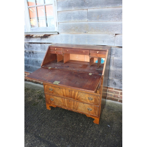 428 - A 19th century figured mahogany fall front bureau with fitted interior over four long graduated draw... 