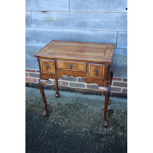 429 - An 18th century design walnut and banded lowboy, fitted one long drawer and two short drawers, on sh... 