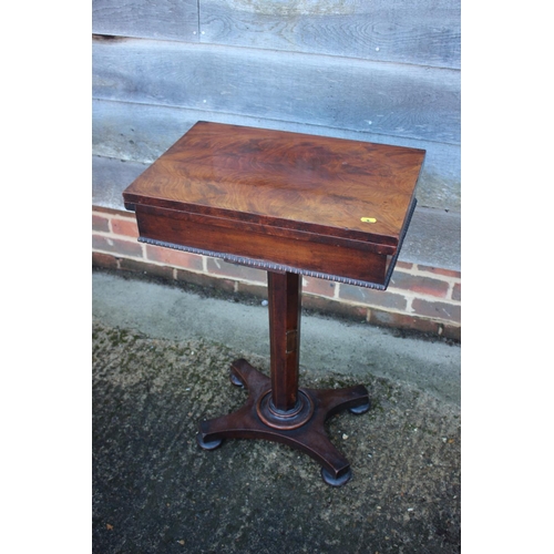 431 - A 19th century figured walnut flap top work table, on octagonal tapered column and quadruple support... 