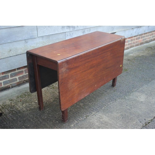 433 - A late Georgian mahogany drop leaf dining table, on moulded and chamfered supports, 48