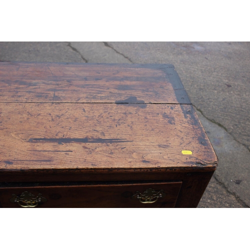 439 - A Georgian oak dresser base, fitted three drawers over three small drawers with flanking cupboards e... 