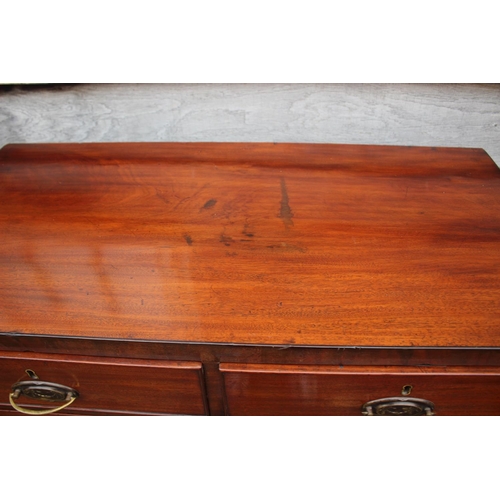 444 - A Georgian mahogany chest of two short and three long graduated drawers with oval brass handles, on ... 