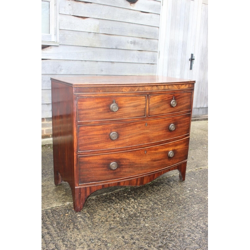 445 - A Georgian mahogany bowfront chest of two short and two long drawers with ring handles, on bracket s... 