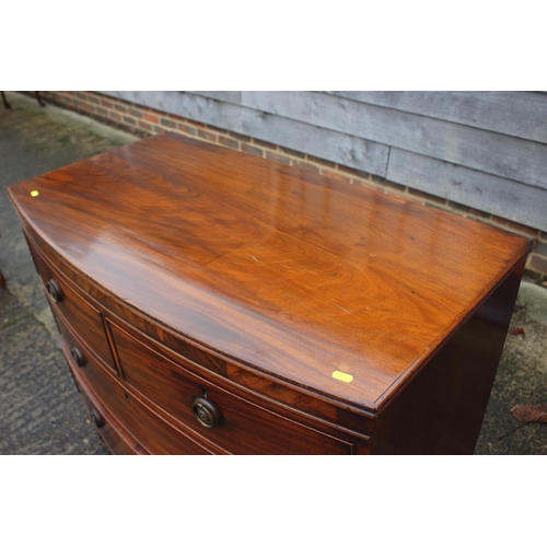 445 - A Georgian mahogany bowfront chest of two short and two long drawers with ring handles, on bracket s... 