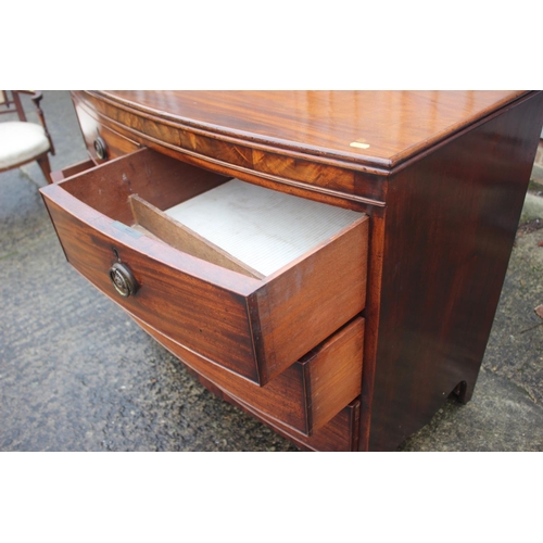 445 - A Georgian mahogany bowfront chest of two short and two long drawers with ring handles, on bracket s... 