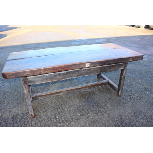 449 - An antique elm slab top refectory table, on chamfered and stretchered supports, top 84