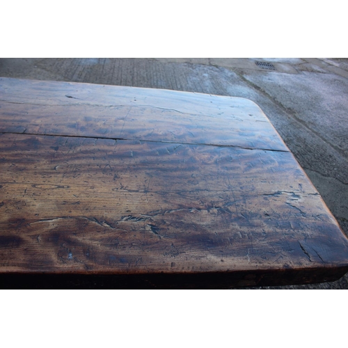 449 - An antique elm slab top refectory table, on chamfered and stretchered supports, top 84