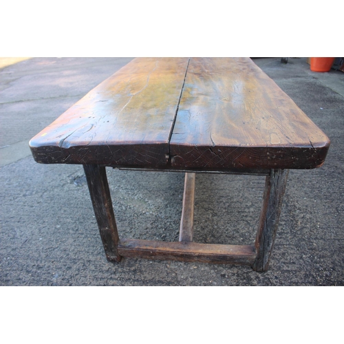 449 - An antique elm slab top refectory table, on chamfered and stretchered supports, top 84