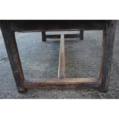 449 - An antique elm slab top refectory table, on chamfered and stretchered supports, top 84