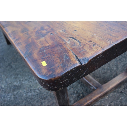 449 - An antique elm slab top refectory table, on chamfered and stretchered supports, top 84