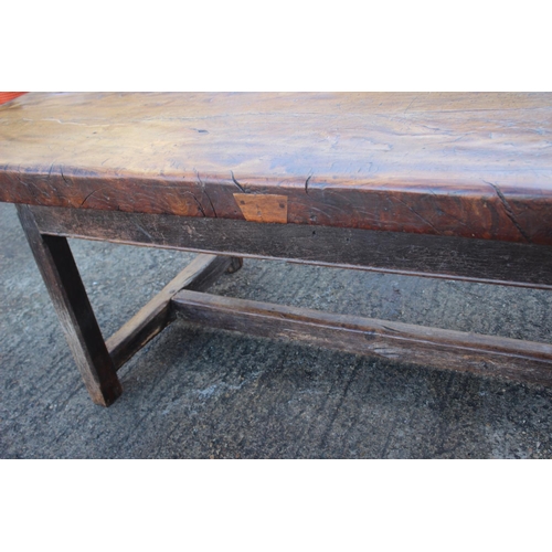 449 - An antique elm slab top refectory table, on chamfered and stretchered supports, top 84