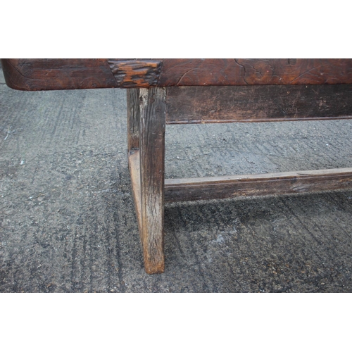 449 - An antique elm slab top refectory table, on chamfered and stretchered supports, top 84