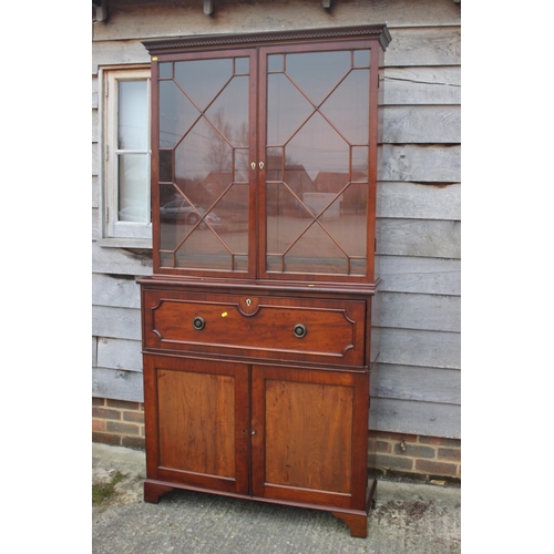 450 - A 19th century mahogany secretaire bookcase, the upper section enclosed lattice glazed doors over fi... 