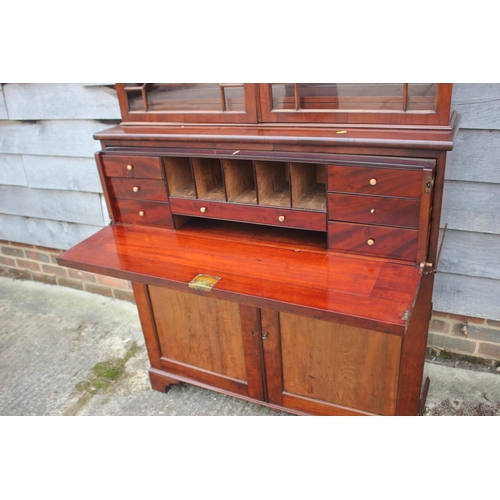 450 - A 19th century mahogany secretaire bookcase, the upper section enclosed lattice glazed doors over fi... 