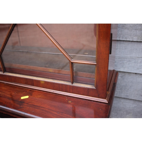 450 - A 19th century mahogany secretaire bookcase, the upper section enclosed lattice glazed doors over fi... 