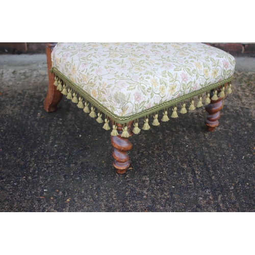 451 - A late 19th century carved oak prie-dieu chair of Restoration design with Jacquard seat and back pan... 