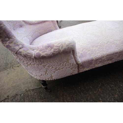 453 - A late Victorian day bed, upholstered in a cut velvet, on turned and castored supports, 60