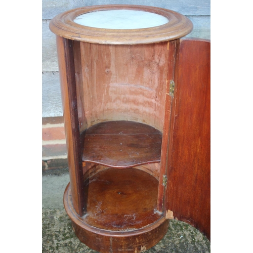 455 - A late 19th century mahogany and marble top cylindrical bedside cupboard enclosed one door, 15