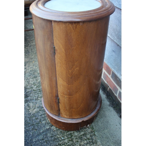 455 - A late 19th century mahogany and marble top cylindrical bedside cupboard enclosed one door, 15