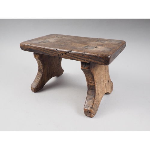 456 - A 19th century chestnut stool, on panel end supports, 10 1/2