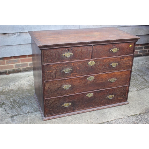 459 - An early Georgian oak and banded chest on chest, the upper section fitted two small and three long g... 