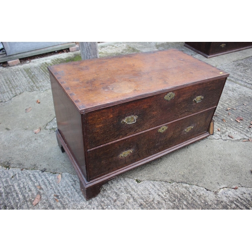 459 - An early Georgian oak and banded chest on chest, the upper section fitted two small and three long g... 