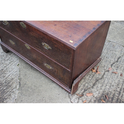 459 - An early Georgian oak and banded chest on chest, the upper section fitted two small and three long g... 