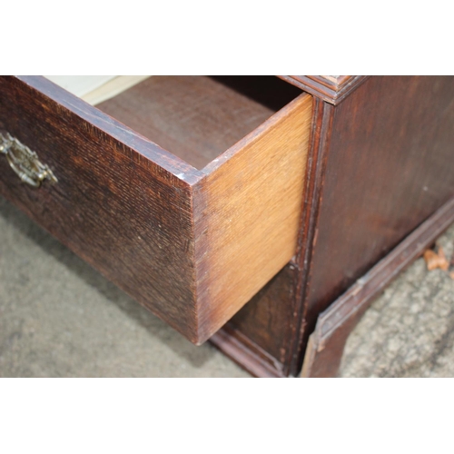 459 - An early Georgian oak and banded chest on chest, the upper section fitted two small and three long g... 