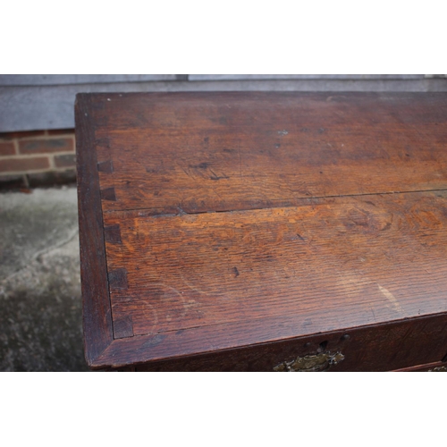 459 - An early Georgian oak and banded chest on chest, the upper section fitted two small and three long g... 