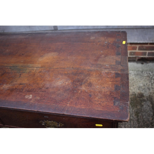 459 - An early Georgian oak and banded chest on chest, the upper section fitted two small and three long g... 