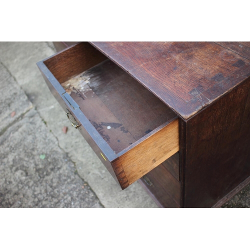 459 - An early Georgian oak and banded chest on chest, the upper section fitted two small and three long g... 