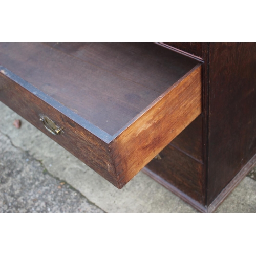 459 - An early Georgian oak and banded chest on chest, the upper section fitted two small and three long g... 