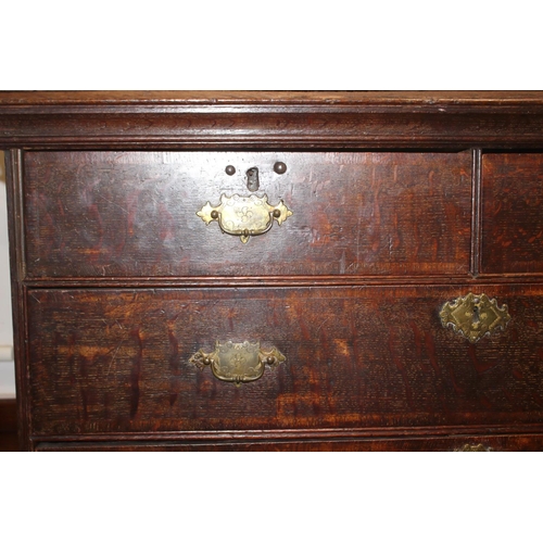 459 - An early Georgian oak and banded chest on chest, the upper section fitted two small and three long g... 