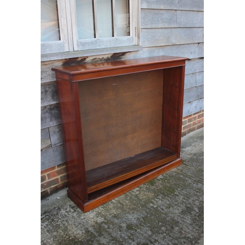 461 - A 19th century walnut open bookcase, fitted adjustable shelves, on block base, 48