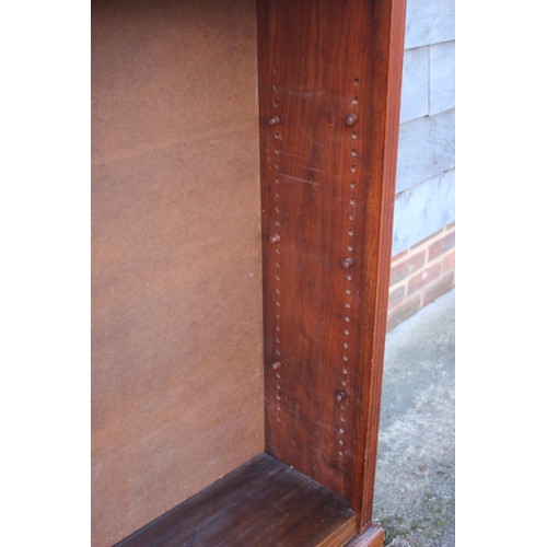 461 - A 19th century walnut open bookcase, fitted adjustable shelves, on block base, 48