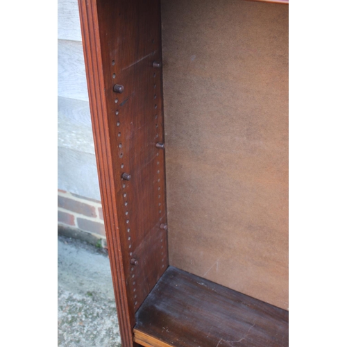 461 - A 19th century walnut open bookcase, fitted adjustable shelves, on block base, 48