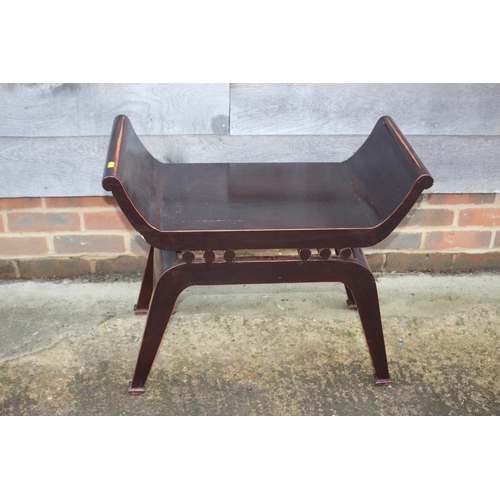 464 - A Chinese lacquered hardwood 'X' frame stool with panel seat, on splay supports, 27 1/4