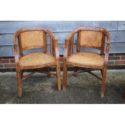 465 - A pair of antique Chinese elm elbow chairs with woven seats and pierced splats, on square taper stre... 