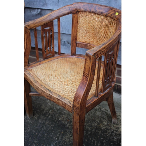 465 - A pair of antique Chinese elm elbow chairs with woven seats and pierced splats, on square taper stre... 