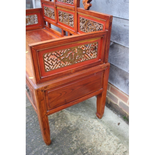 468 - An antique Chinese and hardwood seat with lattice decorated sides and back over four drawers, on sha... 