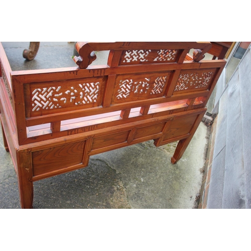 468 - An antique Chinese and hardwood seat with lattice decorated sides and back over four drawers, on sha... 