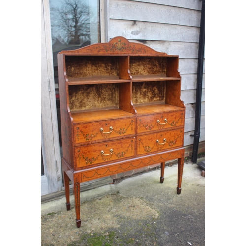 469 - A Sheraton Revival painted satinwood and kingwood banded waterfall bookcase, fitted four drawers, on... 