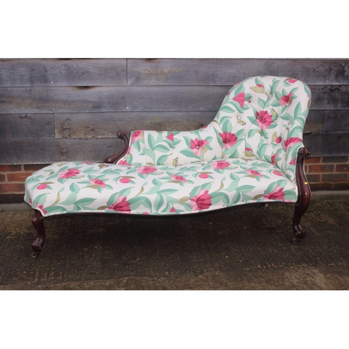 473 - A late 19th century serpentine shaped back chaise longue, button upholstered in a floral linen, on c... 