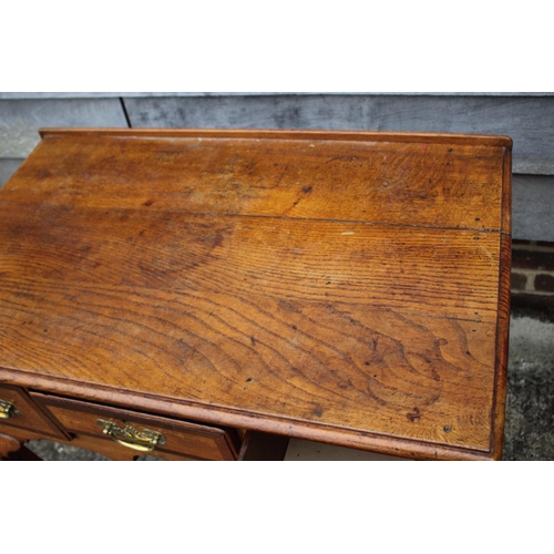 474 - A Georgian provincial oak and mahogany banded lowboy, fitted one shallow and two deep drawers, on ca... 