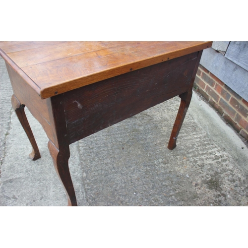 474 - A Georgian provincial oak and mahogany banded lowboy, fitted one shallow and two deep drawers, on ca... 