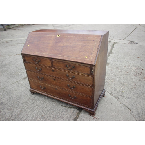 475 - A George III mahogany box and ebony strung fall front bureau, the interior fitted drawers and pigeon... 