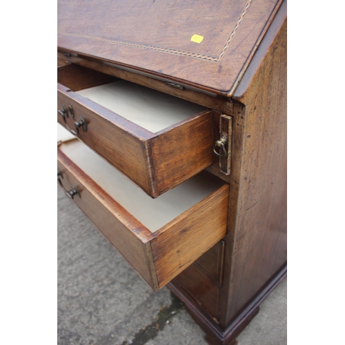 475 - A George III mahogany box and ebony strung fall front bureau, the interior fitted drawers and pigeon... 