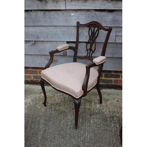 476 - A late 19th century carved pierced walnut elbow chair with padded arms and seat, on cabriole support... 