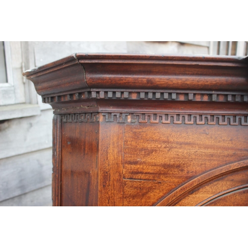 477 - An 18th century mahogany corner cupboard with dental cornice over arch top panelled doors, 38